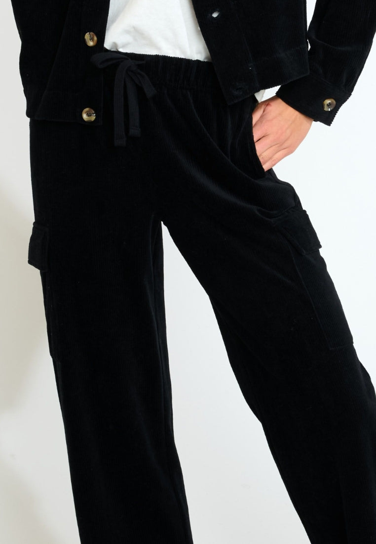 BEYOND-QUANDARY Pantalon de jogging en velours côtelé en Noir Pantalon Banana Moon