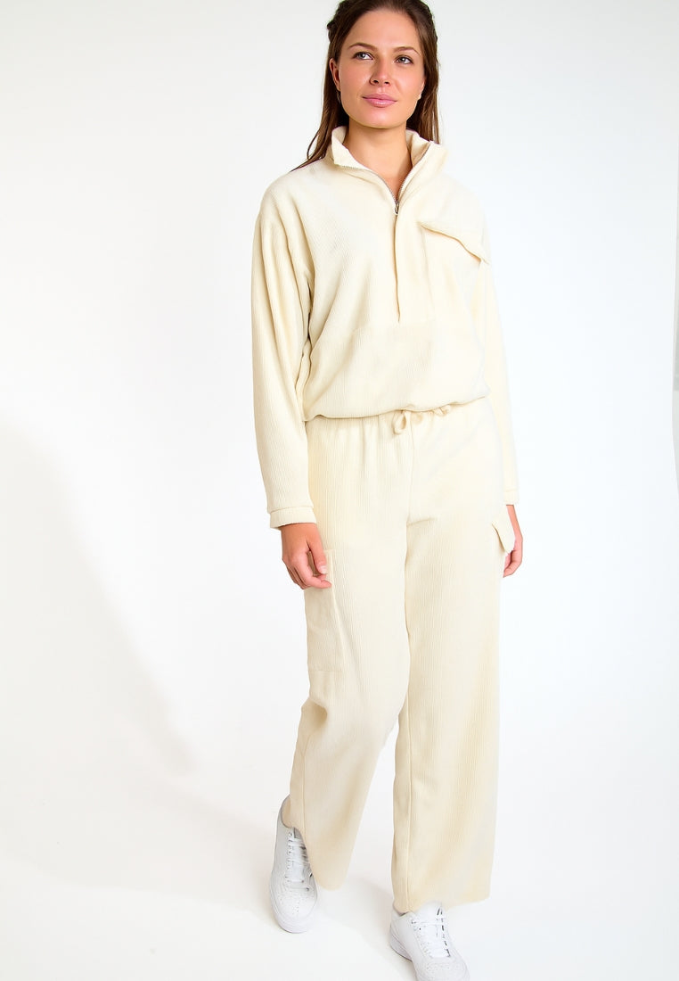 BEYOND-QUANDARY Pantalon de jogging en velours côtelé en écru Pantalons Banana Moon