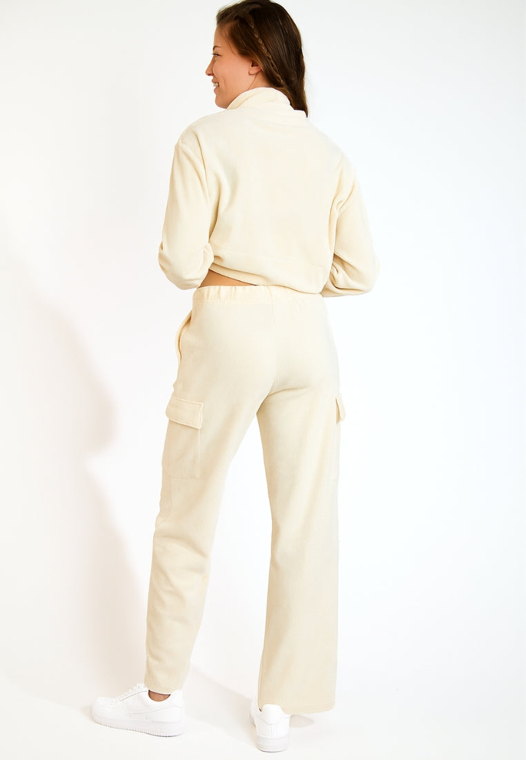 BEYOND-QUANDARY Pantalon de jogging en velours côtelé en écru Pantalons Banana Moon