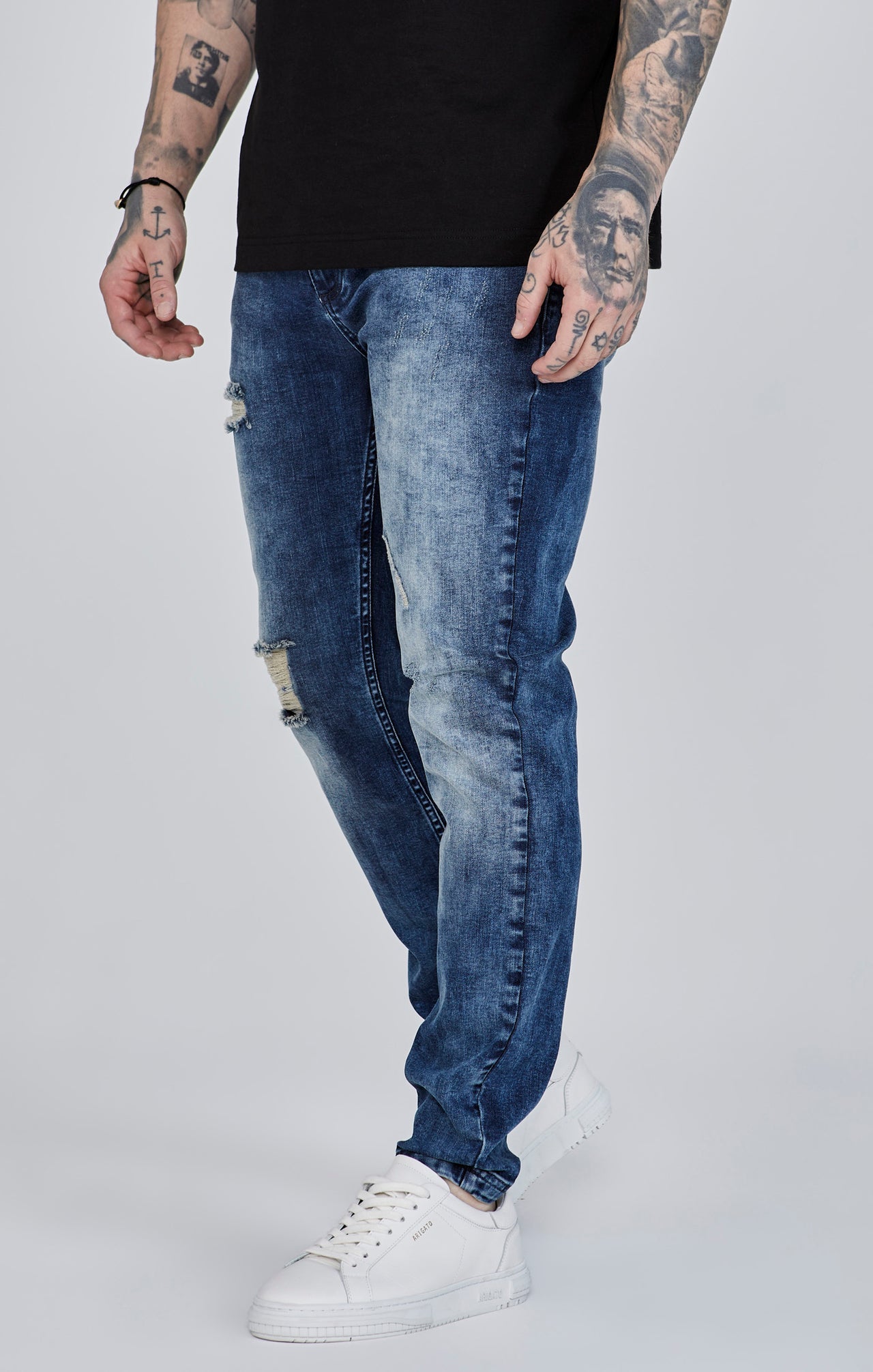 Distressed Slim Fit en bleu Jeans SikSilk
