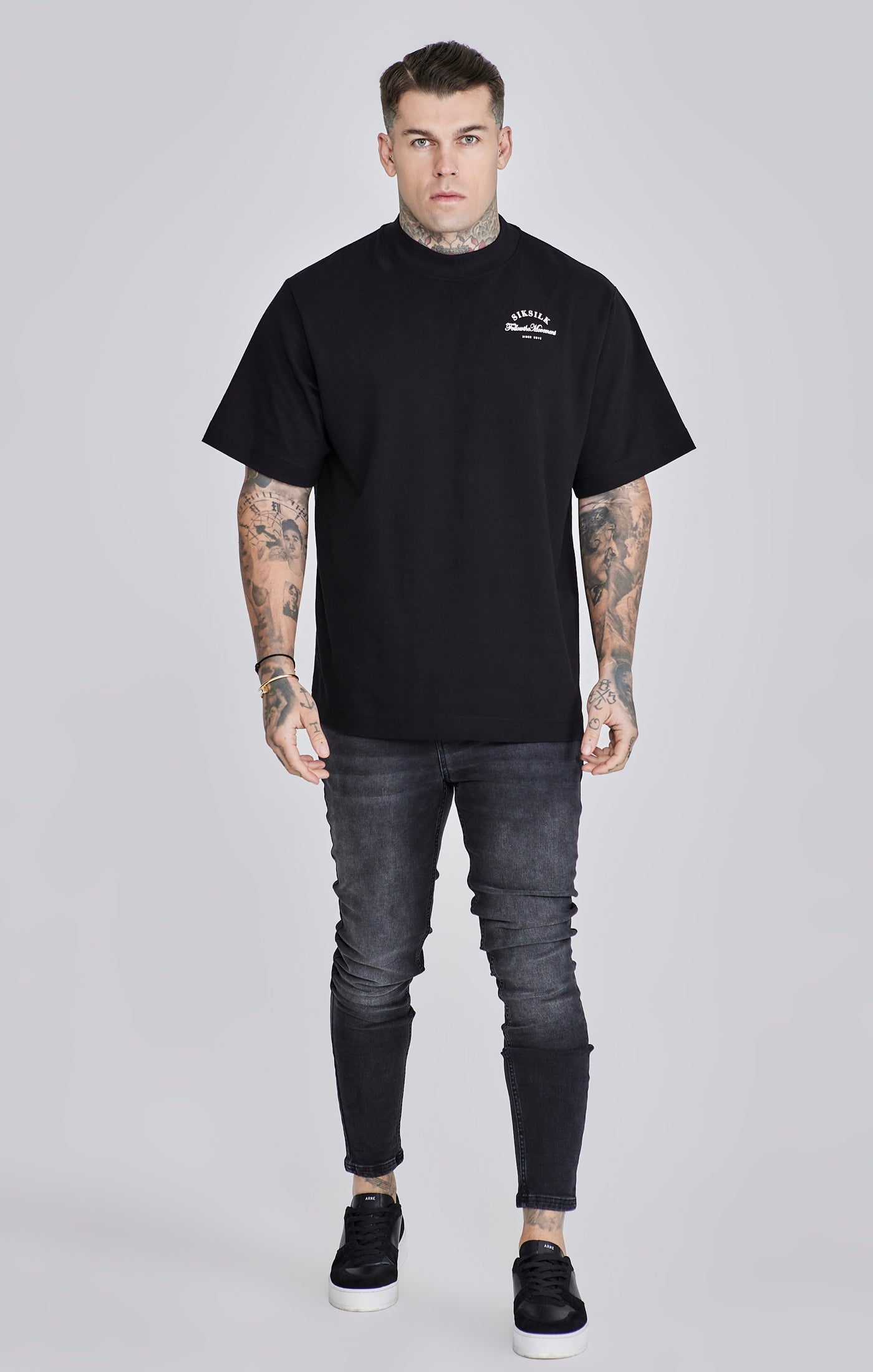 Jeans skinny en noir délavé Jeans SikSilk