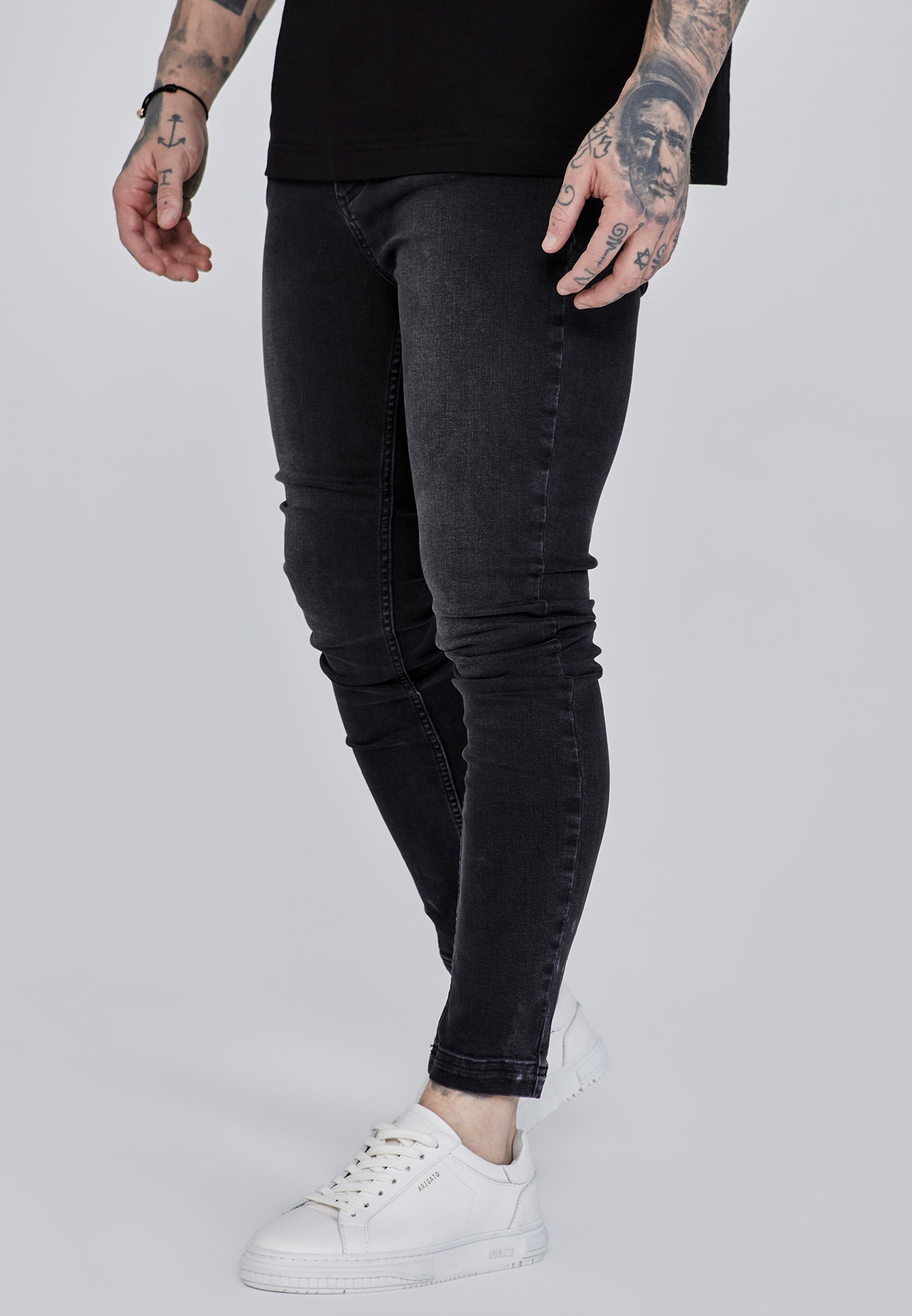 Jeans skinny en noir délavé Jeans SikSilk