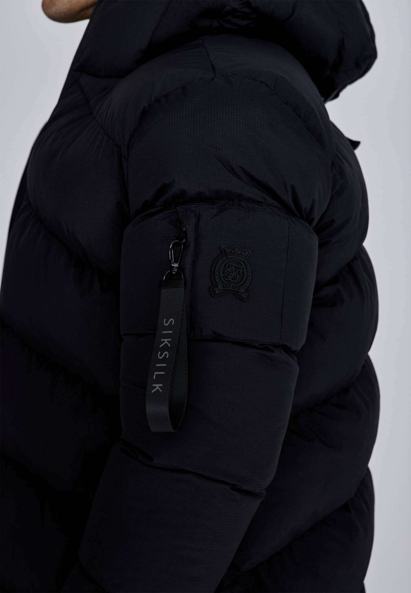 Longline Puffer in Black Vestes SikSilk