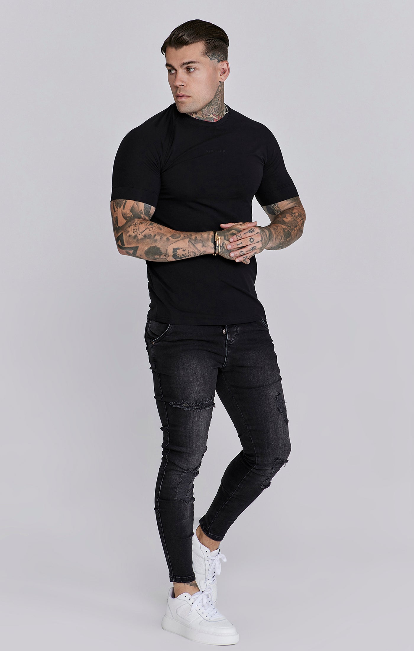 Jeans Distressed Skinny en noir Jeans SikSilk