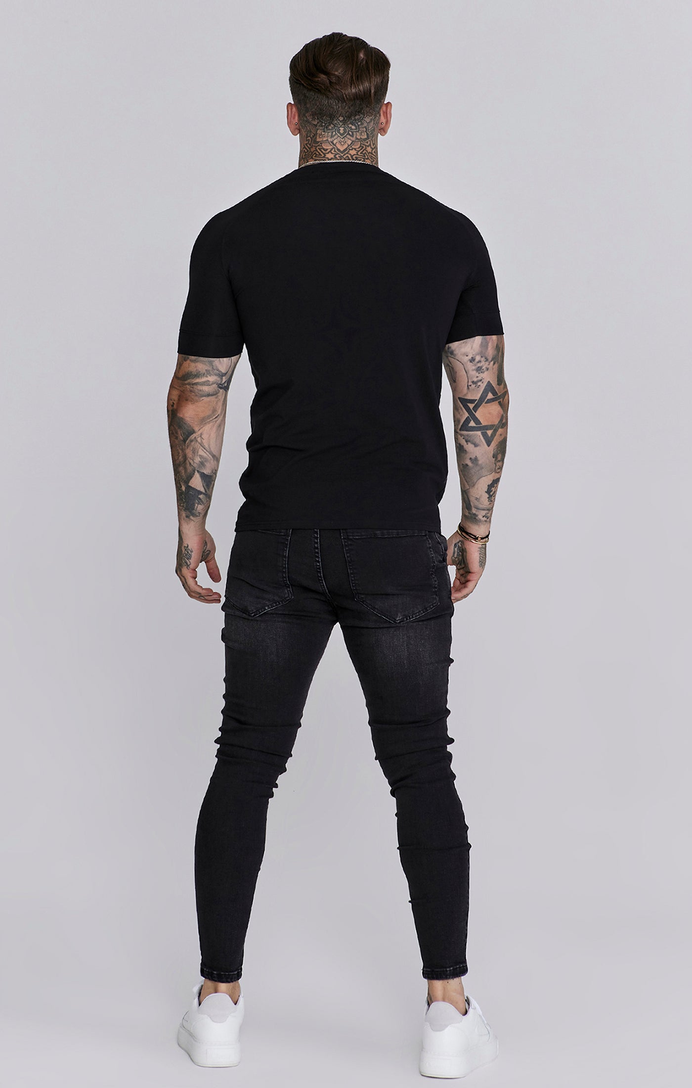 Jeans Distressed Skinny en noir Jeans SikSilk