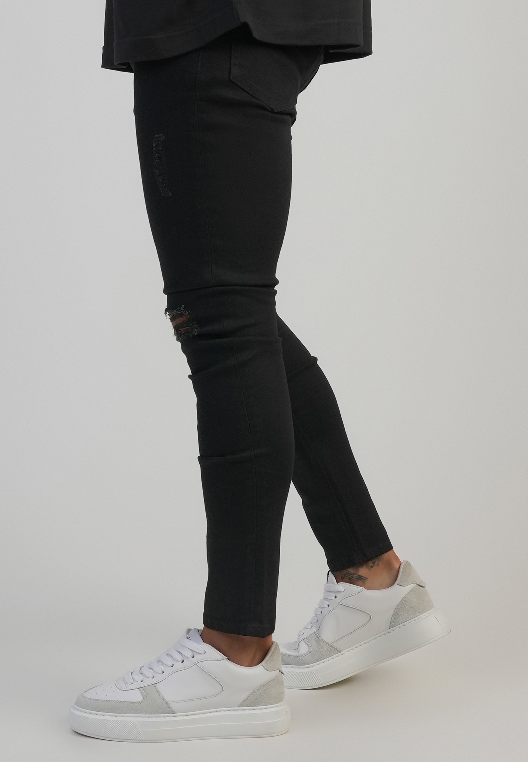 Jeans Distressed Skinny en noir Jeans SikSilk