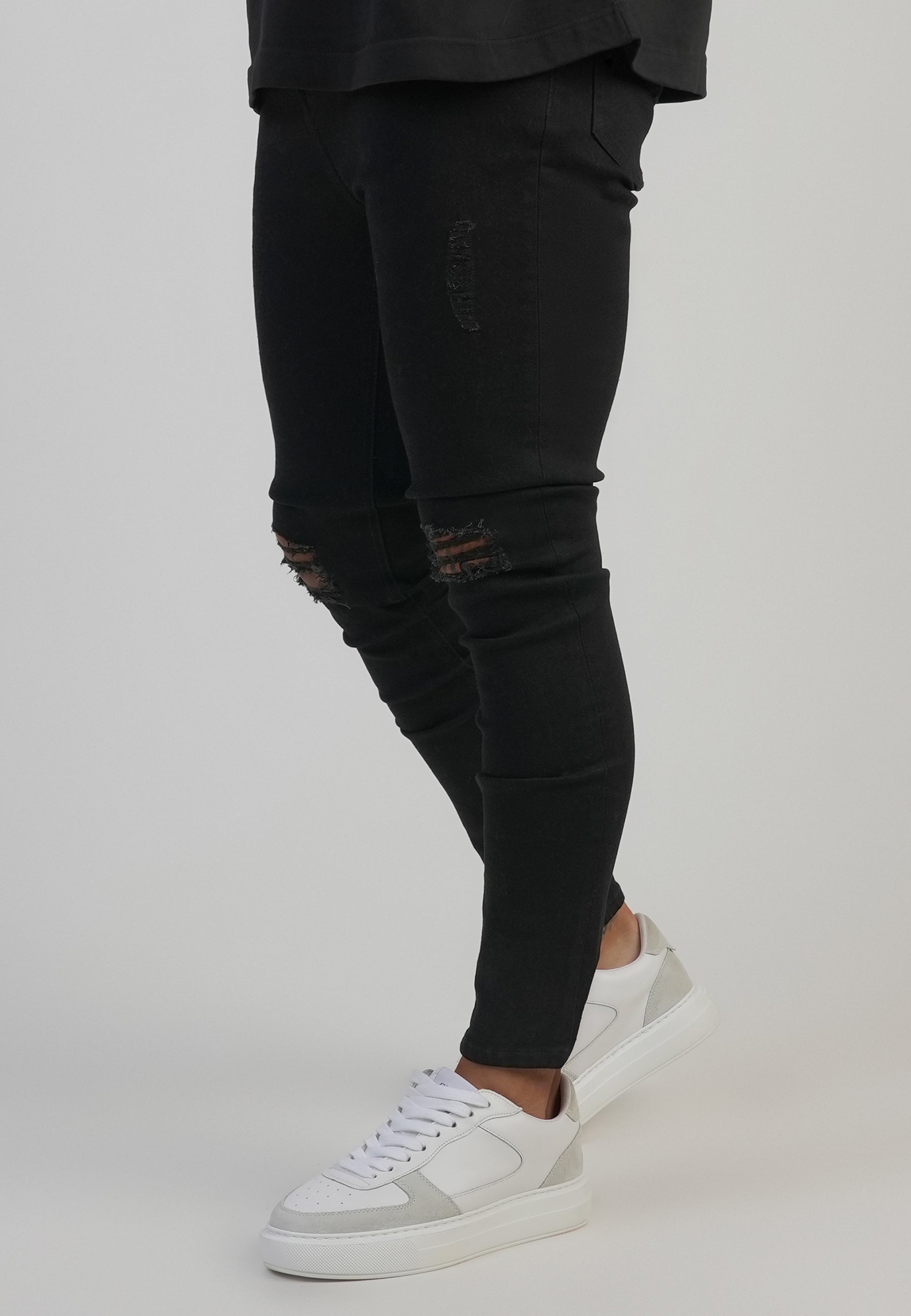 Jeans Distressed Skinny en noir Jeans SikSilk