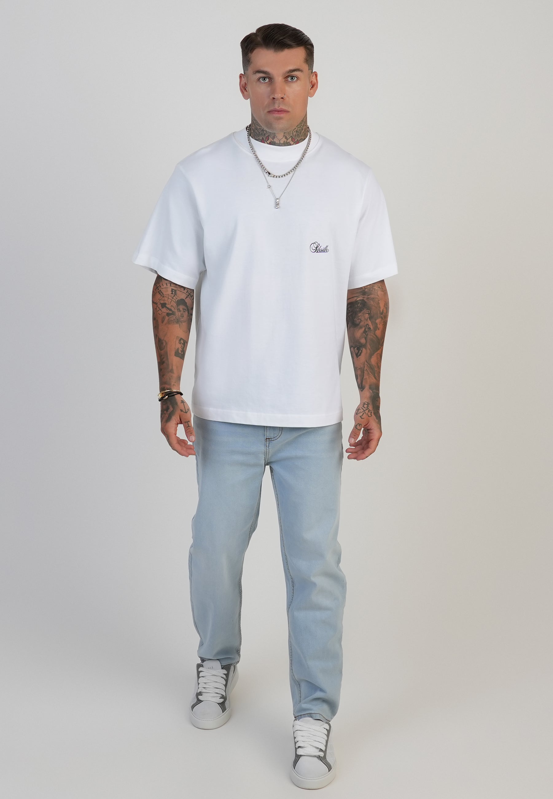 Jeans Tapered Fit en bleu clair délavé Jeans SikSilk
