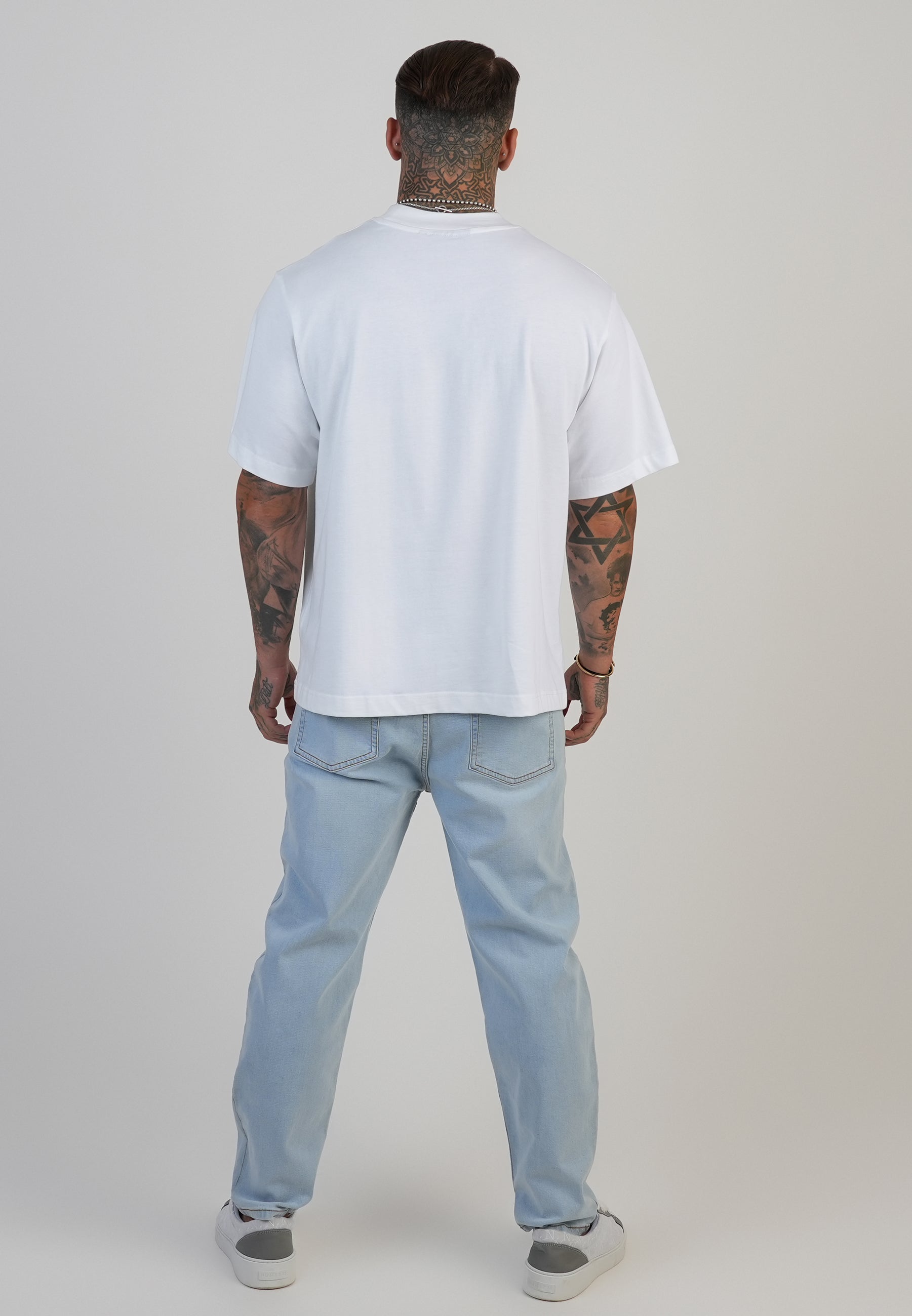 Jeans Tapered Fit en bleu clair délavé Jeans SikSilk