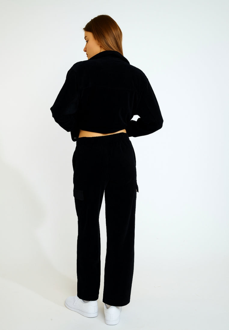 BEYOND-QUANDARY Pantalon de jogging en velours côtelé en Noir Pantalon Banana Moon