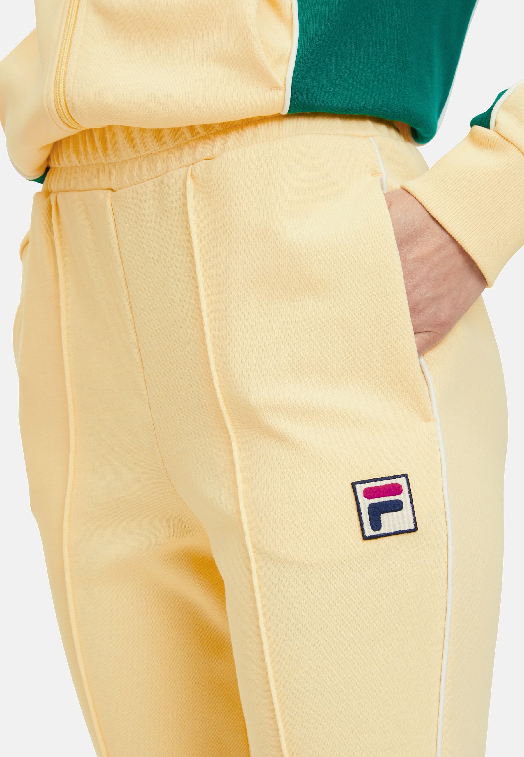 Laiben Bootcut Track Pants en French Vanilla Pantalon Fila   