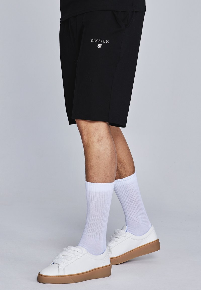 Ensemble polo et short en noir Sets SikSilk